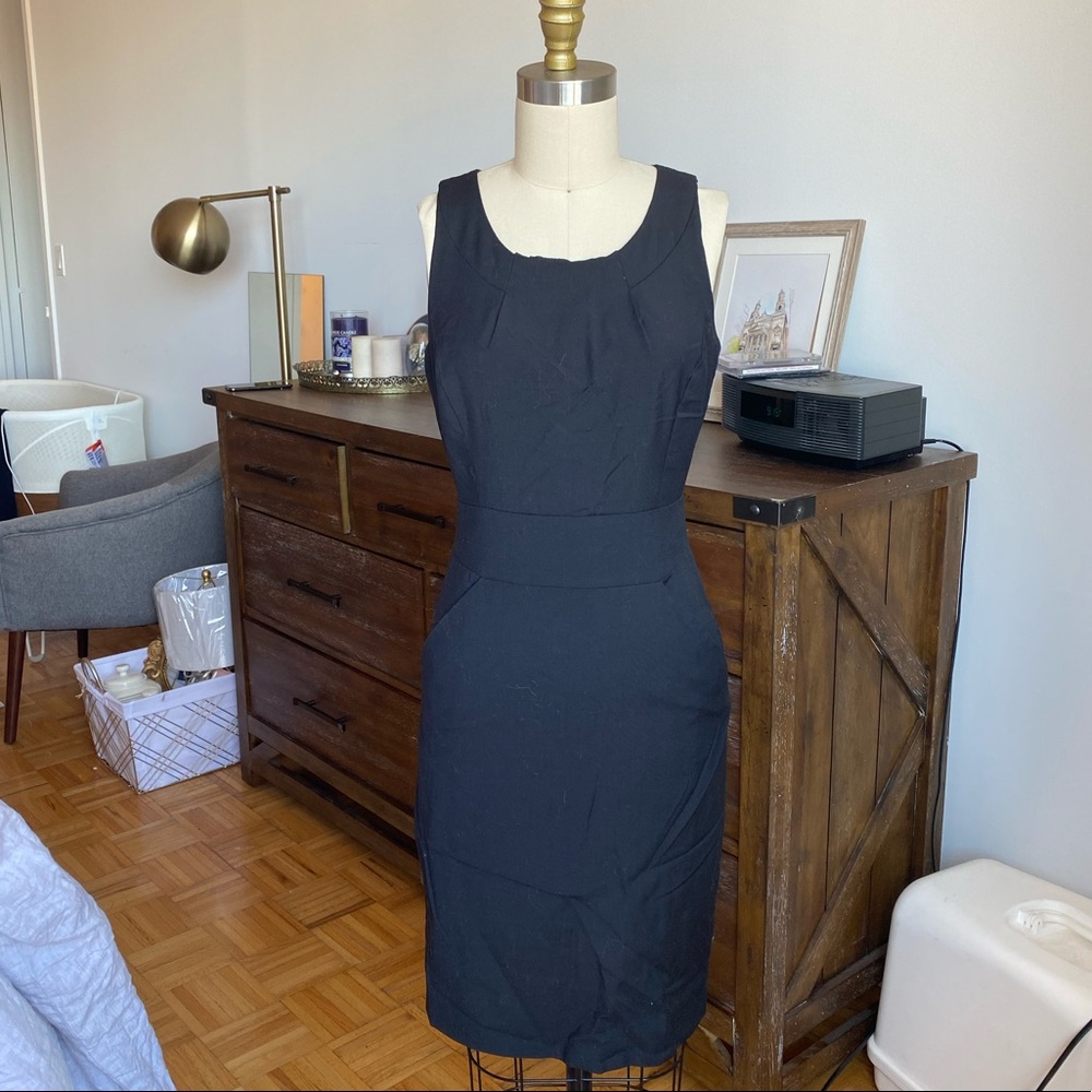 Black sleeveless suit dress